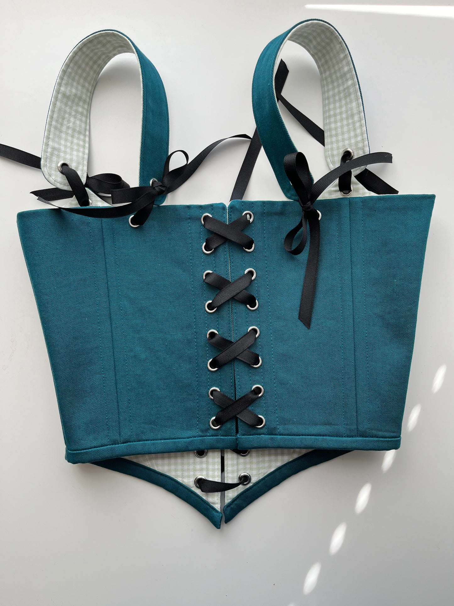 Teal corset with front and back ties, removable shoulder straps,